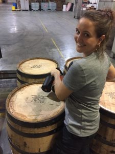 Sazerac Tennessee Distillery - Distiller Allisa Henley stamping barrels