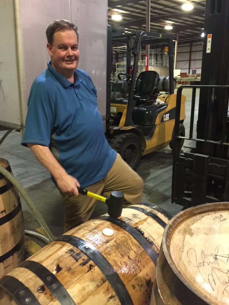 Sazerac Tennessee Distillery - Master Distiller John Lunn bunging the barrel