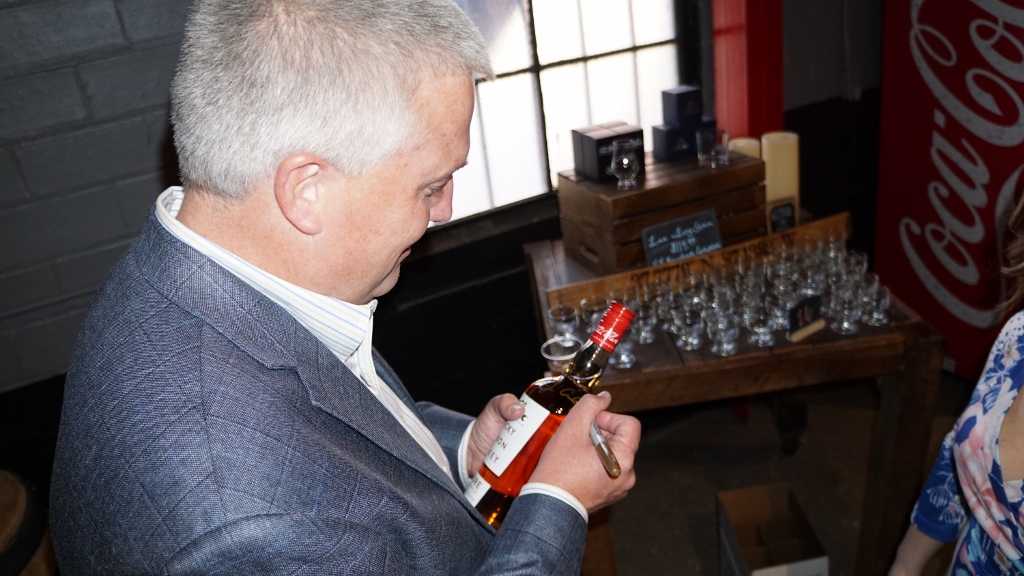 O.Z. Tyler Distillery - Master Distiller Jacob Call signing bottles of Bourbon