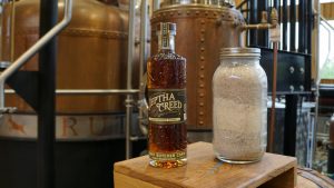 Jeptha Creed Distillery - 4-Grain Kentucky Straight Bourbon Whiskey Bottle and Grains