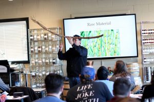 Moonshine University - 5-Day Rum Course Taught by Luis Ayala Co-Founder of Rum University, Holding Sugar Cane