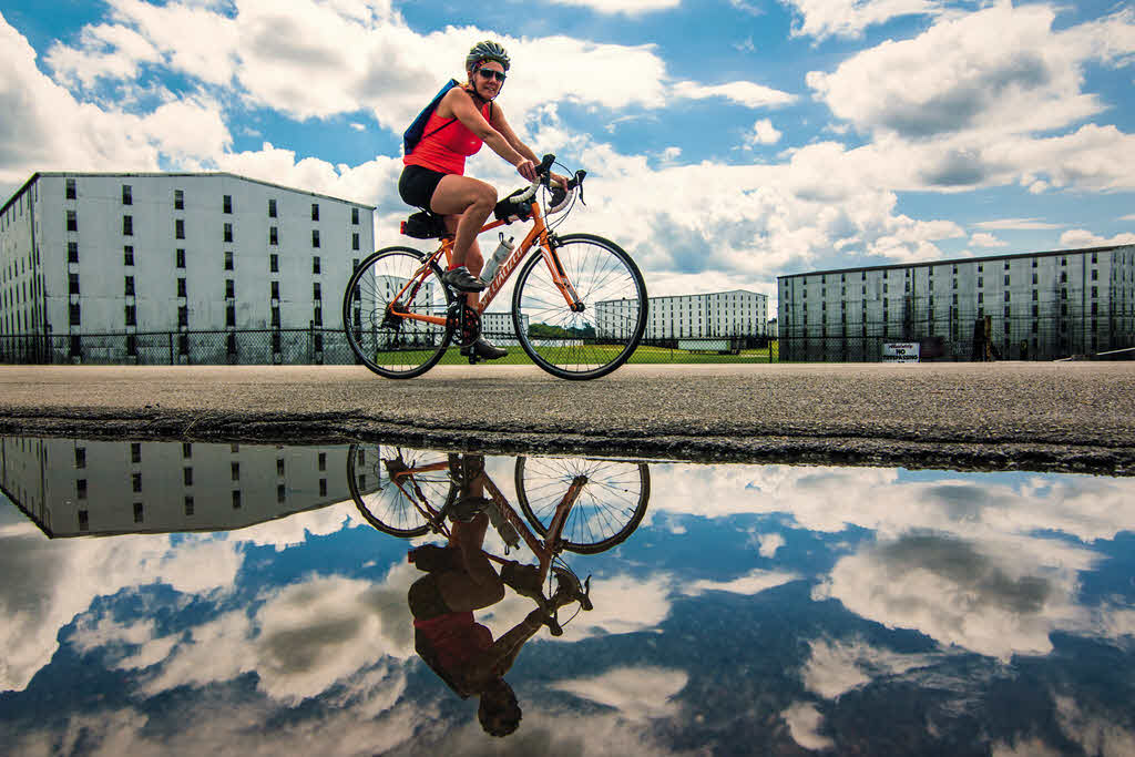 Bardstown the Book - A cyclist pedals past Heaven Hill Distillery