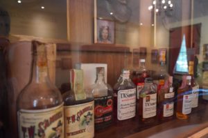 Maker's Mark Distillery - The Samuels House, Living Room, Antique Bottles of T.W. Samuels Bourbon