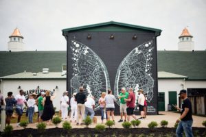 Nearest Green Distillery - The 'What Lifts You' Angel Wings mural by famed Nashville muralist Kelsey Montague