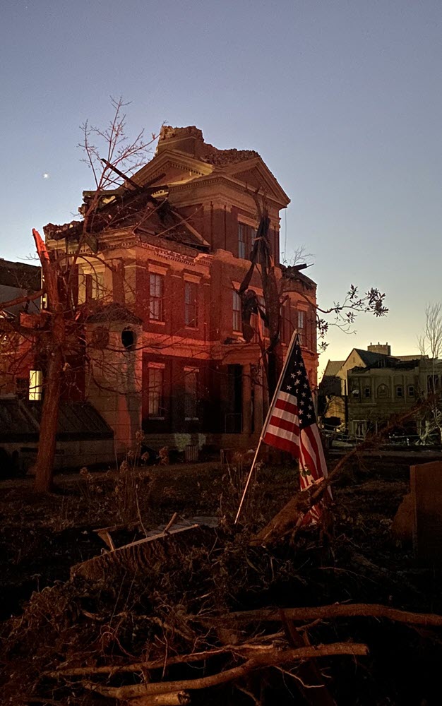Mayfield Courthouse with American Flag at Dawn after the Dec. 11, 2021 Tornado