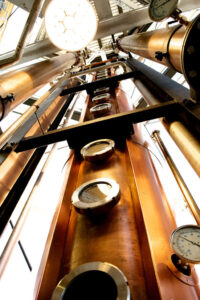 New Riff Distilling - 60 Foot Tall by 24 Inch Diameter with 18 Plates Vendome Copper & Brass Works Continuous Column Still