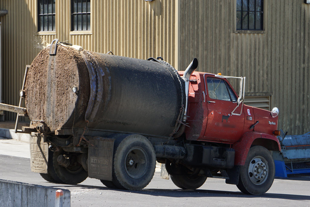 Farmer Picking Up Spent Grains