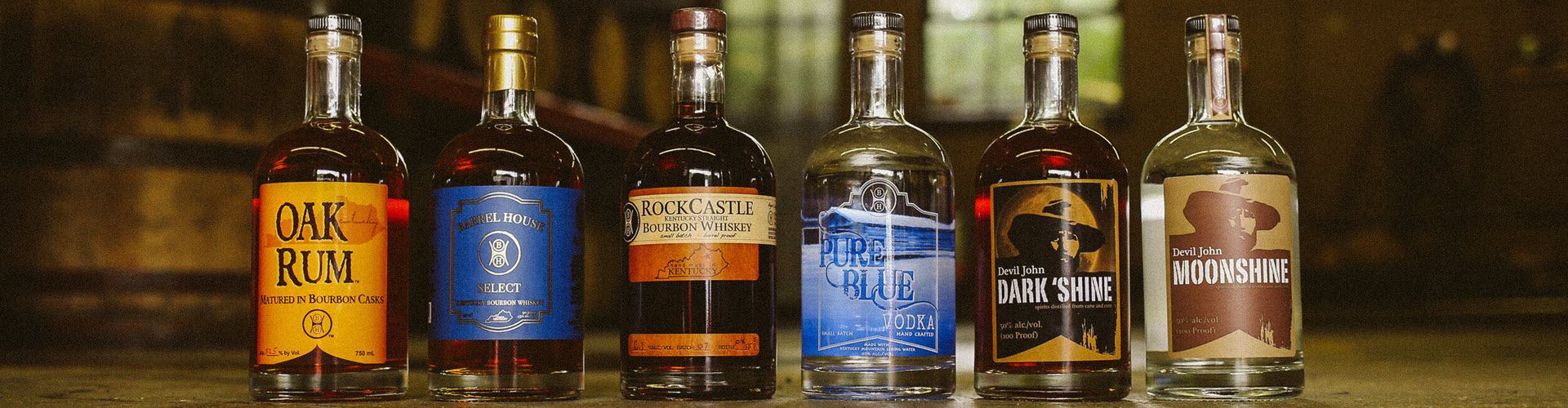 Barrel House Distilling Co. - Rum, Bourbon Select, RockCastle Bourbon, Pure Blue Vodka, Devil John Dark Shine, and Devil John Moonshine Bottles