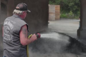Jack Daniel Distillery - Rickyard Burn Tamping Down Fire with Water