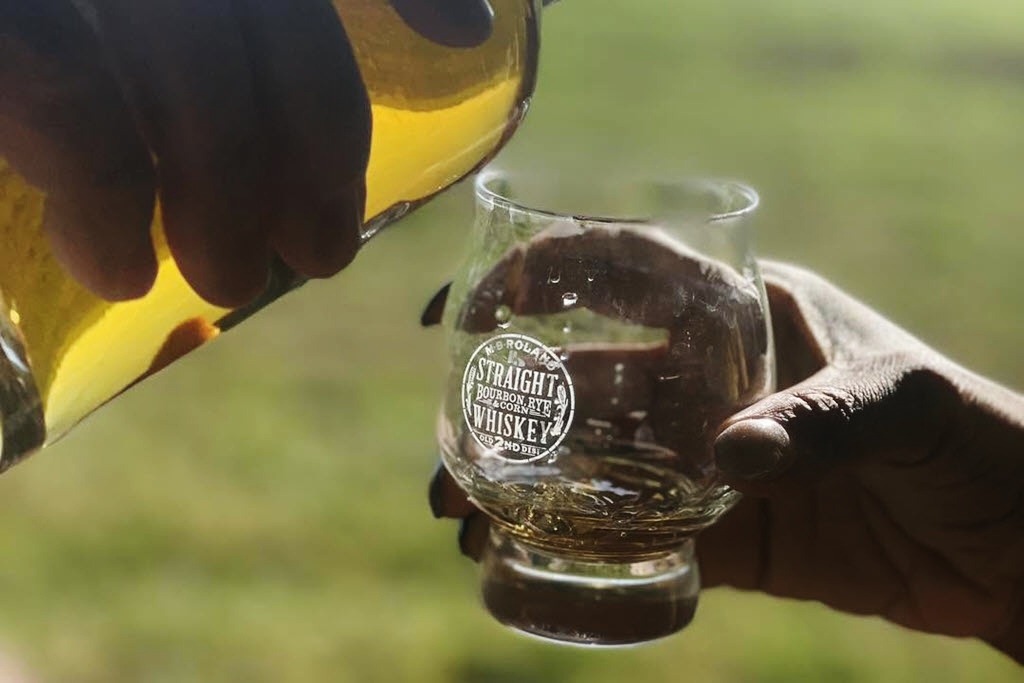 MB Roland Distillery - Filling a Glass of Bourbon